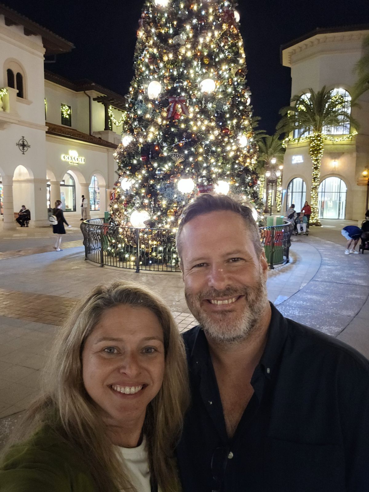 Gabriella and Diego by the Christmas tree